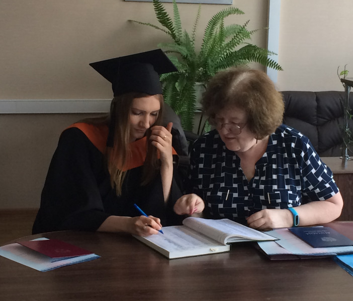 In master's degree graduation gown and academic cap